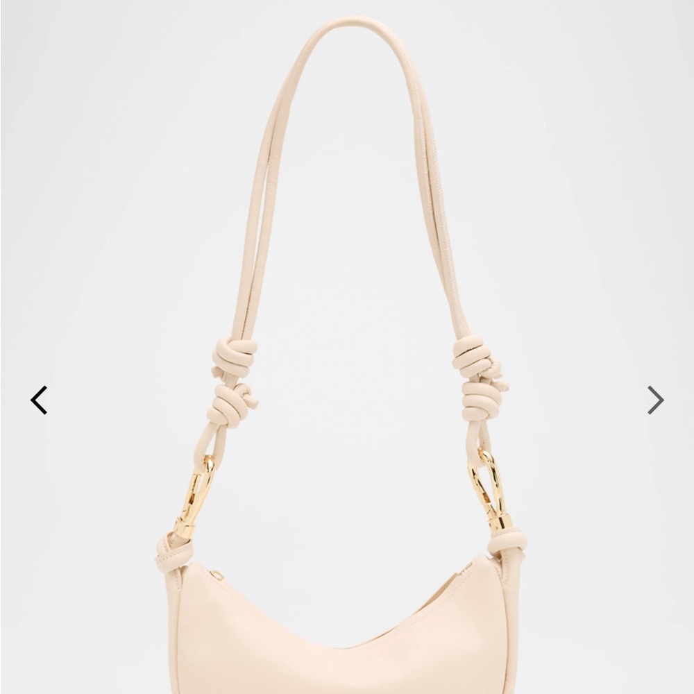 SIMKHAI 

Avery Curved Leather Crossbody Bag